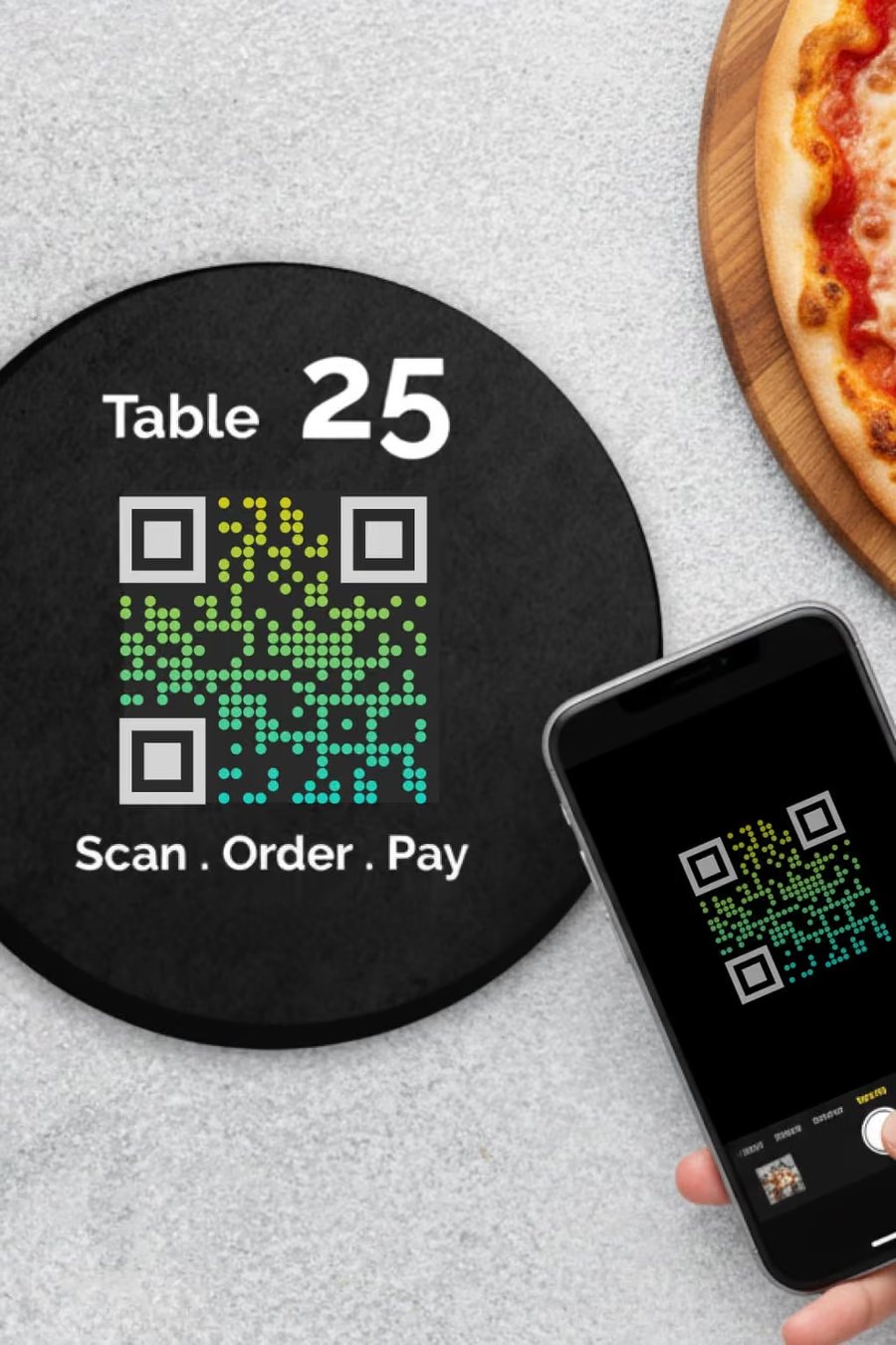 Table QR code coaster reading Scan, Order, Pay next to a phone and a pizza