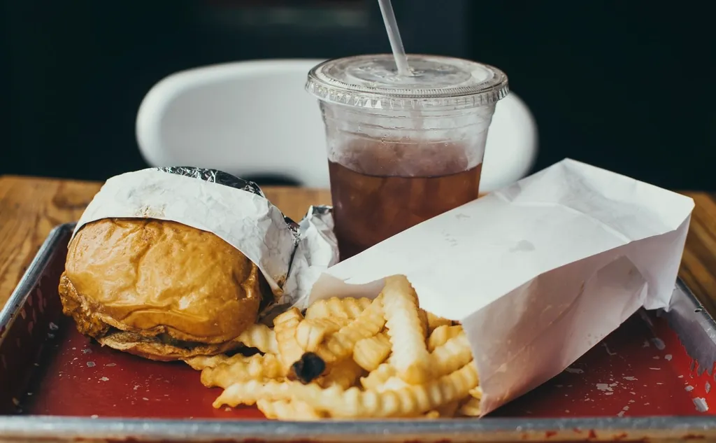 Burger and fries in to-go wrapping