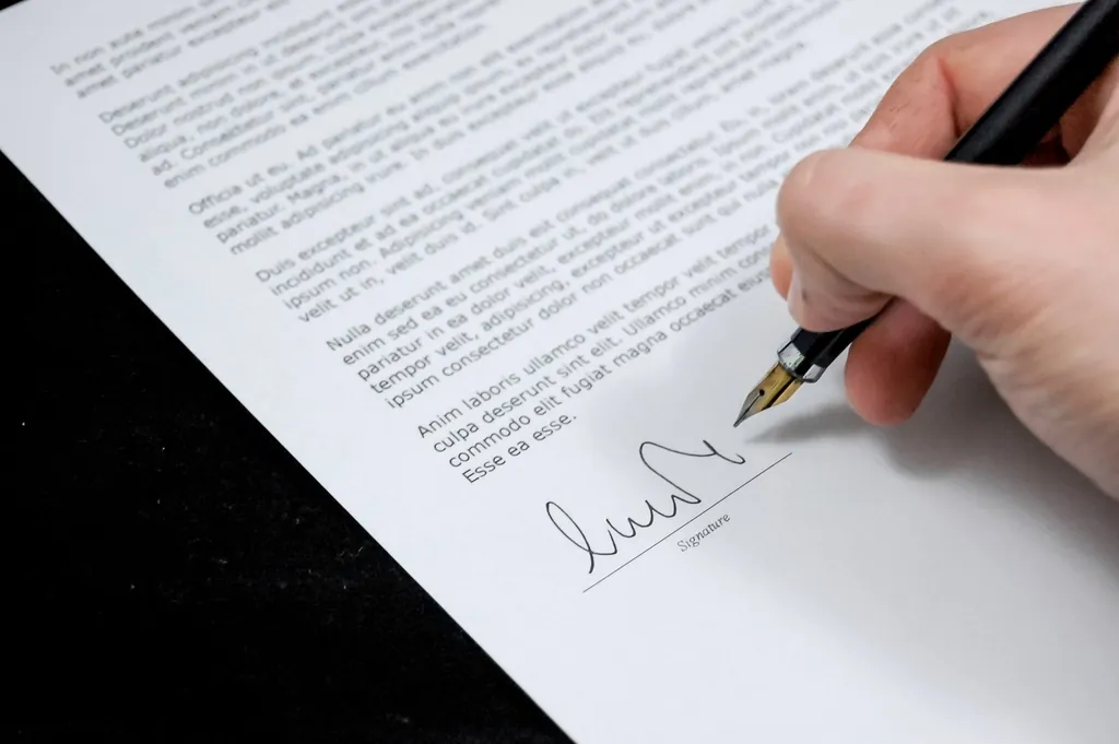 Signing a contract with a pen