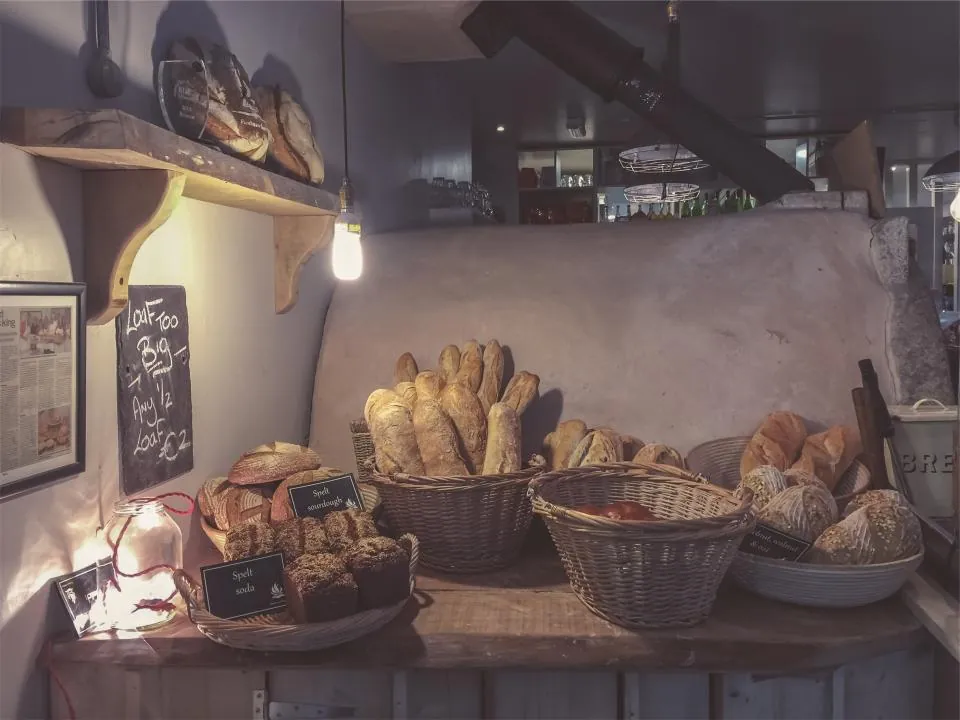 Baskets of fresh bread in a small bakery