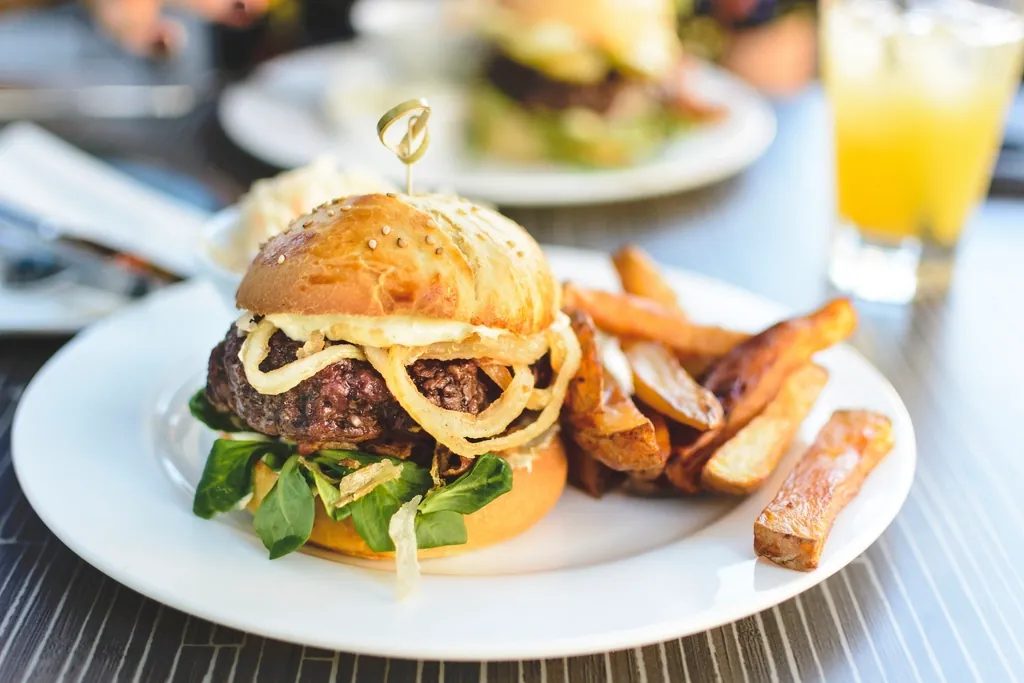 Burger and fries plated for a photo